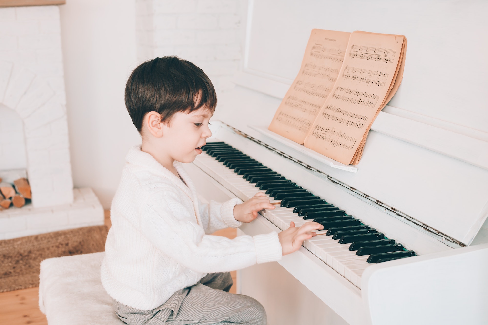 Little boy playing piano lifestyle